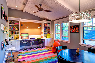 Example of a large eclectic gender-neutral medium tone wood floor kids' room design in Boise with gray walls