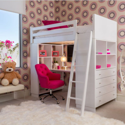 Kids' room - large modern girl carpeted and beige floor kids' room idea in Los Angeles with multicolored walls