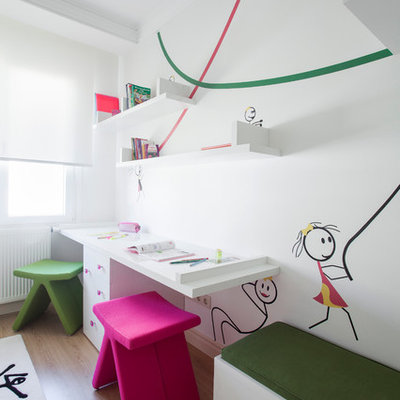 Trendy gender-neutral light wood floor kids' room photo in Other with white walls