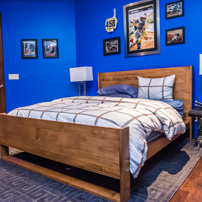 Inspiration for a large modern boy dark wood floor kids' room remodel in Phoenix with blue walls