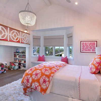 Inspiration for a timeless girl medium tone wood floor kids' bedroom remodel in Orange County with white walls