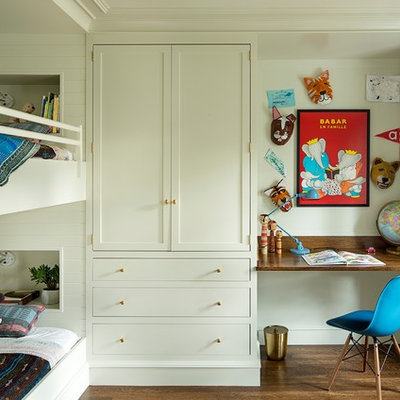 Inspiration for a mid-sized transitional gender-neutral dark wood floor and brown floor kids' room remodel in Portland with white walls