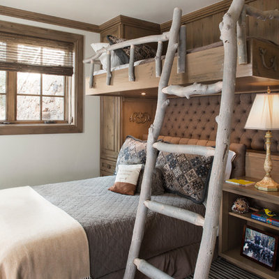 Inspiration for a rustic gender-neutral carpeted kids' bedroom remodel in Denver with white walls