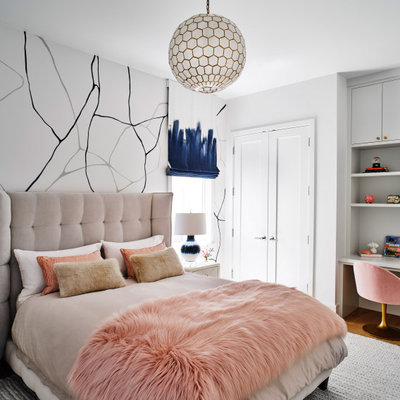 Transitional girl medium tone wood floor, brown floor and wallpaper kids' room photo in San Francisco with white walls