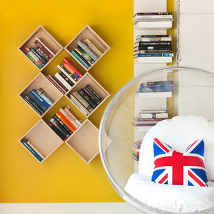 Inspiration for a contemporary gender-neutral concrete floor kids' room remodel in Charlotte with yellow walls