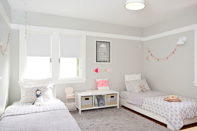 Inspiration for a scandinavian kids' bedroom for girls in San Francisco with grey walls.