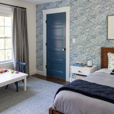Example of a mid-sized eclectic boy dark wood floor kids' room design in Boston with white walls