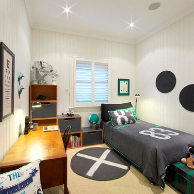 Example of a small trendy boy carpeted kids' room design in Brisbane with white walls