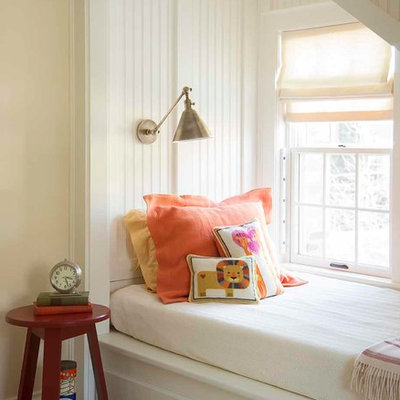 Example of a classic gender-neutral kids' room design in Boston with beige walls
