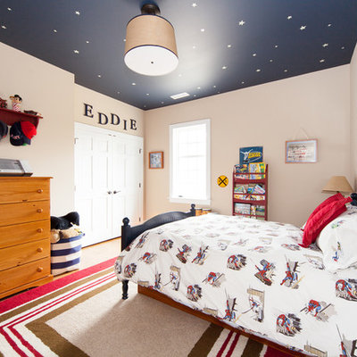 Example of a mid-sized classic boy light wood floor kids' room design in Philadelphia with beige walls