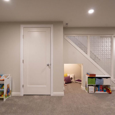 Large 1960s carpeted and brown floor kids' room photo in Calgary with beige walls