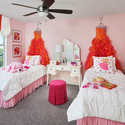 Kids' room - traditional girl carpeted and gray floor kids' room idea in Orlando with pink walls