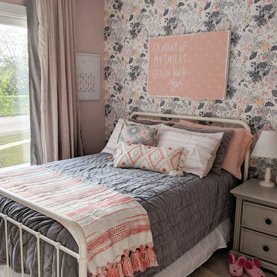 Mid-sized transitional girl carpeted and beige floor kids' room photo in Other with pink walls