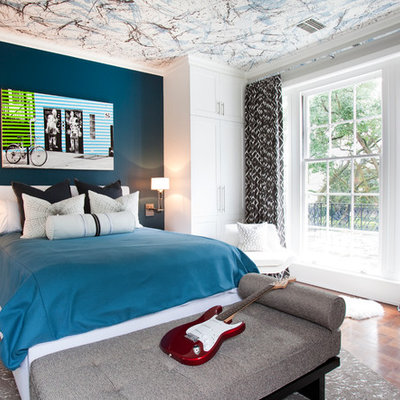 Trendy boy dark wood floor kids' room photo in Houston with multicolored walls