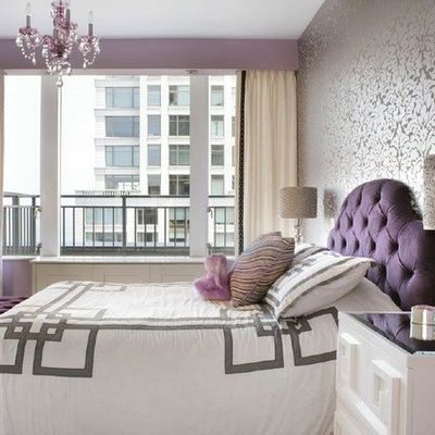 Mid-sized trendy girl medium tone wood floor kids' room photo in New York with purple walls