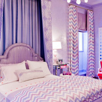 Example of an eclectic girl kids' room design in New York with purple walls