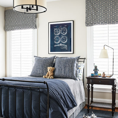 Example of a classic boy medium tone wood floor kids' room design in Philadelphia with beige walls