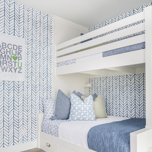 Kids' room - mediterranean gender-neutral light wood floor and beige floor kids' room idea in San Diego with multicolored walls