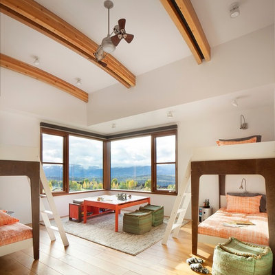 Kids' bedroom - rustic gender-neutral light wood floor kids' bedroom idea in Other with white walls