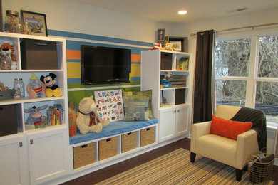 Example of a mid-sized gender-neutral vinyl floor and brown floor kids' room design in Indianapolis with beige walls