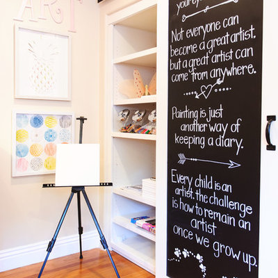 Example of a transitional girl light wood floor kids' room design in San Diego with beige walls