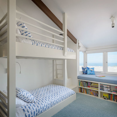 Beach style boy carpeted and blue floor kids' room photo in San Diego with white walls