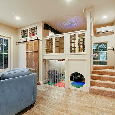 Example of a mid-sized transitional gender-neutral medium tone wood floor and brown floor kids' room design in New Orleans with beige walls