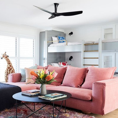 Inspiration for a girl light wood floor kids' room remodel in Other with white walls