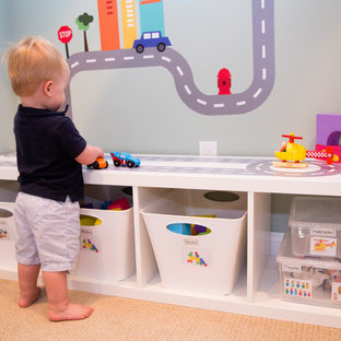 Mid-sized minimalist gender-neutral carpeted kids' room photo in New York with gray walls