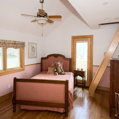 Inspiration for a timeless girl kids' room remodel in Houston with pink walls