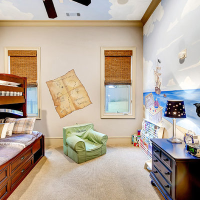 Inspiration for a mid-sized transitional boy carpeted kids' room remodel in Dallas with multicolored walls