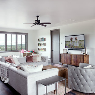 Example of a mid-sized transitional girl dark wood floor and brown floor kids' room design in Austin with white walls