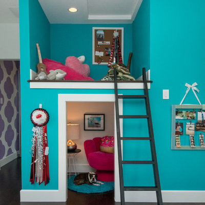 Kids' room - transitional girl dark wood floor kids' room idea in Austin with blue walls