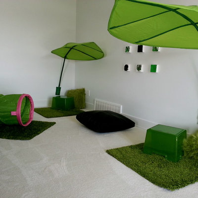 Mid-sized minimalist gender-neutral carpeted playroom photo in Edmonton with white walls