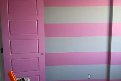 Inspiration for an eclectic gender-neutral carpeted and beige floor kids' room remodel in Edmonton with pink walls