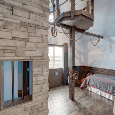 Example of an eclectic boy medium tone wood floor playroom design in Edmonton