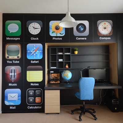 Example of a trendy boy kids' room design in Other with multicolored walls