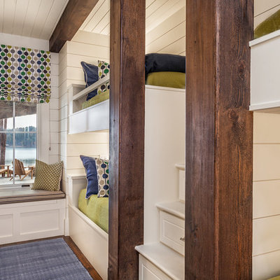 Mid-sized country boy dark wood floor kids' room photo in Other with white walls