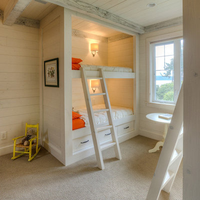 Example of a classic girl carpeted kids' room design in Seattle with beige walls