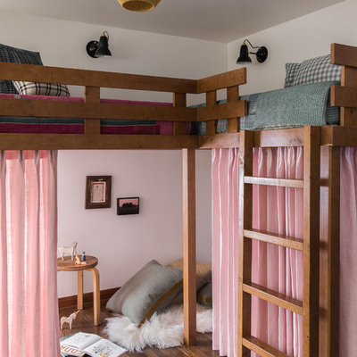 Kids' bedroom - 1950s medium tone wood floor and brown floor kids' bedroom idea in Seattle with white walls