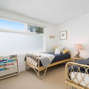 Contemporary gender-neutral kids' bedroom in Sydney with white walls, carpet and beige floor for kids 4-10 years old.