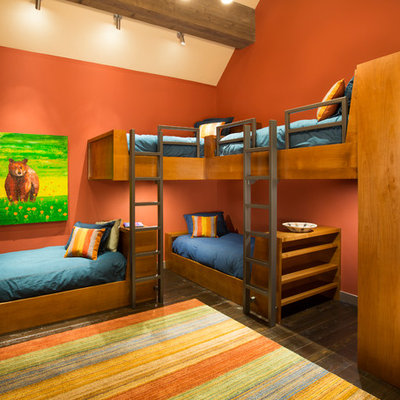 Trendy gender-neutral dark wood floor kids' room photo in San Francisco with orange walls