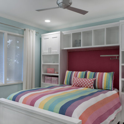 Example of a classic girl kids' room design in Sacramento with blue walls