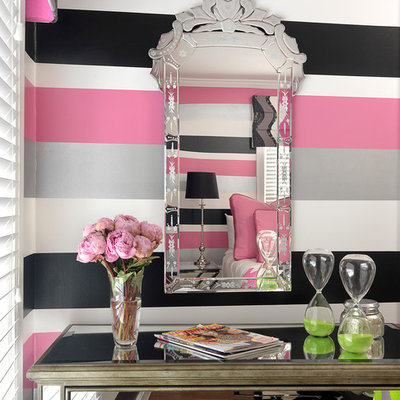 Example of a mid-sized trendy girl medium tone wood floor kids' room design in Other with multicolored walls