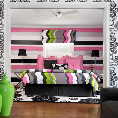 Mid-sized trendy girl medium tone wood floor kids' room photo in Other with multicolored walls