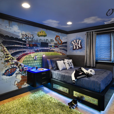 Example of a trendy boy kids' room design in San Francisco with multicolored walls