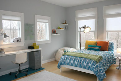 Inspiration for a transitional gender-neutral bamboo floor and beige floor kids' room remodel in New York with gray walls