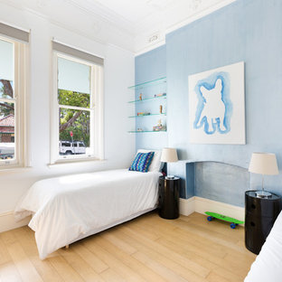 Inspiration for a contemporary kids' bedroom for kids 4-10 years old and boys in Sydney with blue walls and light hardwood floors.