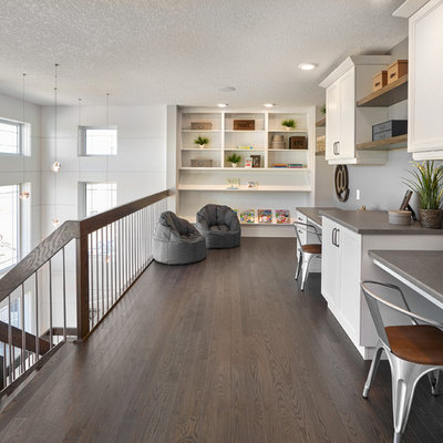 Kids' study room - transitional gender-neutral dark wood floor kids' study room idea in Edmonton with gray walls