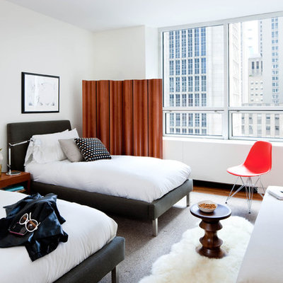 Inspiration for a 1960s gender-neutral carpeted kids' room remodel in New York with white walls